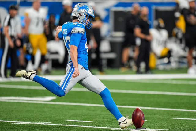 Detroit Lions kicker launching a field goal attempt during live NFL action